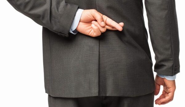 businessman-with-fingers-crossed-behind-back-image-www-socialselect-net_